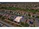 Aerial view of single-story house with backyard and neighborhood at 7824 Homing Pigeon St, North Las Vegas, NV 89084