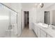 Modern bathroom with double vanity and large mirror at 912 Calluna Hills Ln, Las Vegas, NV 89138