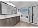 Double vanity bathroom with soaking tub and walk-in shower at 10044 Glen Aire Ave, Las Vegas, NV 89148