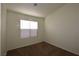 Bright bedroom with carpet and a window with blinds at 11076 Zampino St, Las Vegas, NV 89141