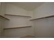 Large walk-in closet with shelving and hanging rods at 11076 Zampino St, Las Vegas, NV 89141