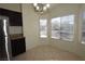 Bright dining area with large windows and a chandelier at 11076 Zampino St, Las Vegas, NV 89141