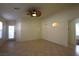 Living room with tile floors, sliding door to backyard at 11076 Zampino St, Las Vegas, NV 89141