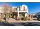 Two-story house with balcony, attached garage, and landscaping at 1898 Versante Ave, Las Vegas, NV 89183