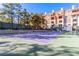 Well-maintained tennis court with building in background at 260 E Flamingo Rd # 230, Las Vegas, NV 89169