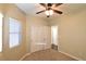 Spacious bedroom with ceiling fan, large closet, and neutral decor at 304 Whitney Breeze Ave, North Las Vegas, NV 89031