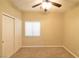 Spacious bedroom with ceiling fan, large closet, and neutral color scheme at 304 Whitney Breeze Ave, North Las Vegas, NV 89031