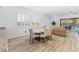 Bright dining room features a chandelier and seating for six at 314 Homeward Way, Henderson, NV 89011