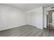 Bedroom with mirrored closet doors and gray vinyl flooring at 3151 Soaring Gulls Dr # 2110, Las Vegas, NV 89128