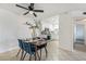 Cozy dining area with a wooden table and blue chairs at 3151 Soaring Gulls Dr # 2110, Las Vegas, NV 89128