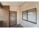 Condo building entryway with a brown door and window at 3151 Soaring Gulls Dr # 2110, Las Vegas, NV 89128