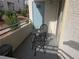 Small condo patio with table and two chairs at 3318 N Decatur Blvd # 1013, Las Vegas, NV 89130