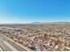 Aerial view of homes near a highway, mountain background at 337 Warmside Dr, Las Vegas, NV 89145