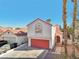 Two-story house with red garage door and walkway at 337 Warmside Dr, Las Vegas, NV 89145