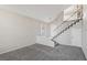 Spacious living room with grey carpet and staircase at 337 Warmside Dr, Las Vegas, NV 89145