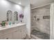 Modern bathroom with a walk-in shower, white vanity, and tile flooring at 508 Indian Princess Dr # 101, Las Vegas, NV 89145