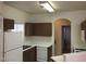 Kitchen with brown cabinets and white countertops at 5525 W Flamingo Rd # 2011, Las Vegas, NV 89103