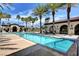 Inviting pool area with palm trees, lounge chairs, and a relaxing atmosphere at 5721 Keystone Crest St, North Las Vegas, NV 89081