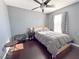 Cozy bedroom with hardwood floors and ceiling fan at 68 Jewel Mine Ave, Las Vegas, NV 89183