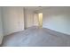 Spacious bedroom with neutral carpeting and ample closet space at 7089 Burcot Ave # A89, Las Vegas, NV 89156