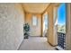 Private balcony with textured walls and wrought iron railing at 7293 Iron Oak Ave, Las Vegas, NV 89113