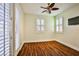 Bedroom with wood flooring, and french doors leading to backyard at 7293 Iron Oak Ave, Las Vegas, NV 89113