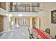 Two-story dining room with marble floors, chandelier, and fireplace at 7293 Iron Oak Ave, Las Vegas, NV 89113