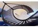 Spiral staircase viewed from above, showcasing its unique design at 7293 Iron Oak Ave, Las Vegas, NV 89113