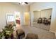 Serene bedroom with mirrored closet doors and seating area at 7321 Gentle Valley St, Las Vegas, NV 89149