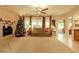 Spacious living room with fireplace, Christmas tree and large windows at 7321 Gentle Valley St, Las Vegas, NV 89149