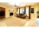 Comfortable living room featuring a fireplace and large windows at 7321 Gentle Valley St, Las Vegas, NV 89149