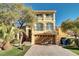 Two-story house with a two-car garage and landscaped yard at 8456 Blackstone Ridge Ct, Las Vegas, NV 89139