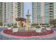 Ornate building entrance with fountain and landscaping at 9103 Alta Drive Dr # 407, Las Vegas, NV 89145