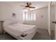 Bedroom with ceiling fan and window with plantation shutters at 913 Pro Players Dr, Las Vegas, NV 89134