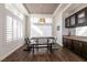 Bright dining area with large window and hardwood floors at 913 Pro Players Dr, Las Vegas, NV 89134