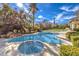 Resort-style pool and spa with a large backyard and beautiful landscaping at 9805 Winter Palace Dr, Las Vegas, NV 89145