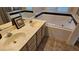 Bathroom with double sinks, tub and shower at 1022 Weatherboard St, Henderson, NV 89011