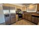 Kitchen with stainless steel appliances and light wood cabinets at 1022 Weatherboard St, Henderson, NV 89011