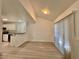 Dining area adjacent to the kitchen, with wood-look flooring and large windows at 1024 Sun Wood Dr, Las Vegas, NV 89145