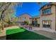 Artificial turf backyard with patio and seating area at 10620 Austin Bluffs Ave, Las Vegas, NV 89144