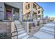 Modern townhome community with gray and white exteriors, and a walkway at 11576 Ashy Storm Ave, Las Vegas, NV 89138