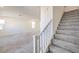 Modern staircase with carpeted steps and white railing leading to upper level at 11576 Ashy Storm Ave, Las Vegas, NV 89138