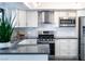 Modern kitchen with stainless steel appliances and white cabinets at 1424 Daniel Dr, Las Vegas, NV 89117