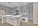 Modern kitchen with gray cabinets and large island at 1670 Boundary Peak Way, Las Vegas, NV 89135