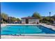 Community pool with adjacent restrooms and lounge chairs at 209 Belmont Canyon Pl, Henderson, NV 89015