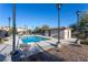 Community pool with restrooms and lounge chairs, surrounded by landscaping at 209 Belmont Canyon Pl, Henderson, NV 89015