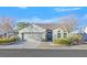 Single-story house with a two-car garage and well-manicured landscaping at 2426 Bedford Park Dr, Henderson, NV 89052