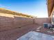 Small, private backyard with gravel and a patio area at 2878 Red Rooster Ct, Las Vegas, NV 89123