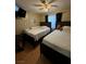 Bedroom with two double beds and ceiling fan at 3020 Tabor Ave, North Las Vegas, NV 89030