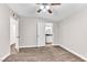 Bedroom with door to bathroom and ceiling fan at 3108 Emmons St, North Las Vegas, NV 89030